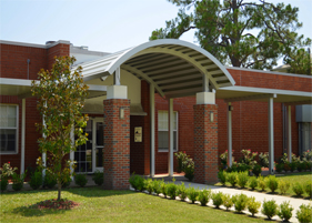 curved aluminum canopy at school entrance