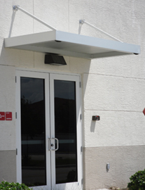 small aluminum awning above door