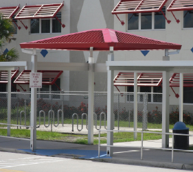 tall red pavilion with red sunshade system in the background