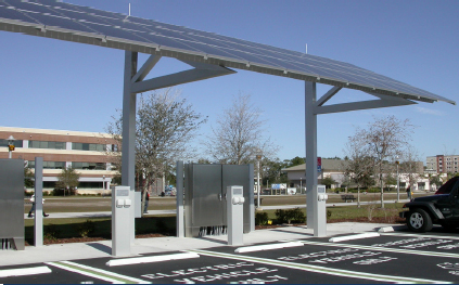 solar panels positioned over electric car parking stations