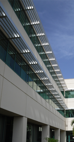 two-teir sunshade system attached to side of building